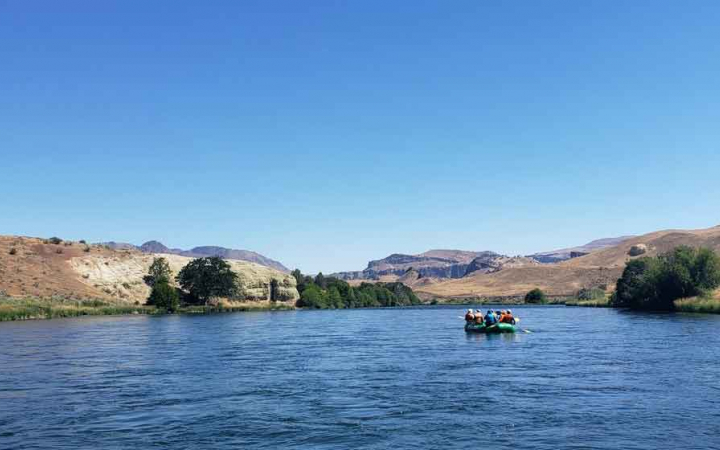 women float down river on rafting trip with outward bound